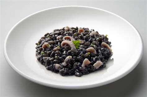  Risotto al Nero di Seppia: Creamy decadence infused with an oceanic whisper!